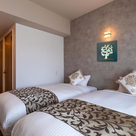 Mr Kinjo 万座ビーチ前 Lejlighedshotel Onna Eksteriør billede