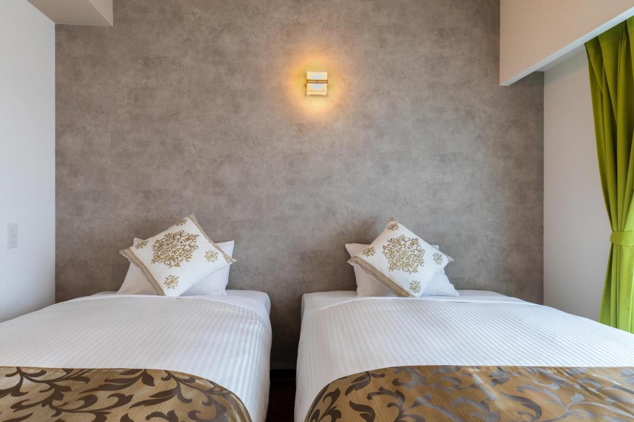 Mr Kinjo 万座ビーチ前 Lejlighedshotel Onna Eksteriør billede